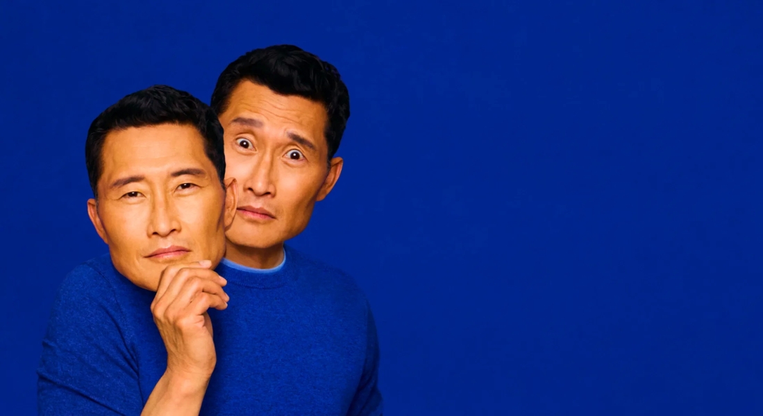 Daniel Dae Kim holding a cardboard cut out of his own face